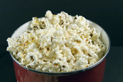 a pic of a large portion of popcorn as portion control is one of the weight gain causes